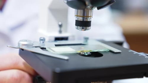 Laboratory hospital chemistry experiment. Close up view of microscope researching.