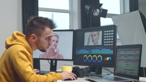 Freelance Videographer Colorist Editing Footage Using Professional Software Monitor and Montage
