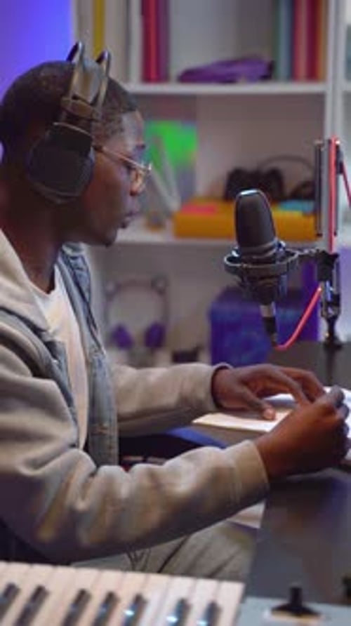 Black Man Artist Recording Music While Playing Electronic Piano at Home Studio Creative Songwriter