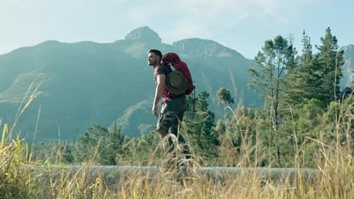 Hiker Walks Rural Trail Through Mountains
