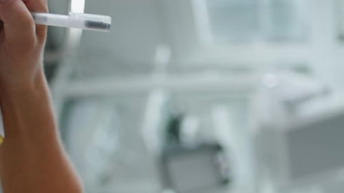 Woman Receives Facial Exam at Skincare Clinic