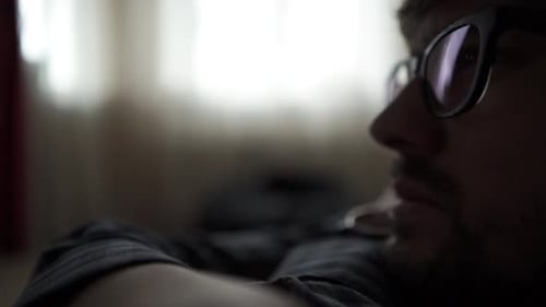 Adult with Glasses Looking to the Side