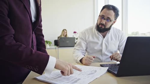 Business Men Working Together on Project