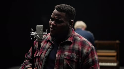 Vocalist Singing With A Pianist In A Studio