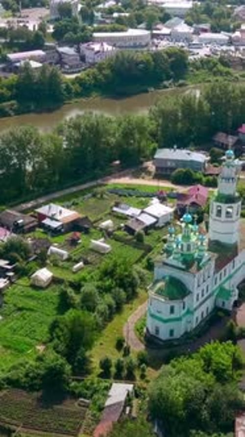 Top View of Beautiful Church in Town By River in Summer Clip Old Colorful Church in Town By River on