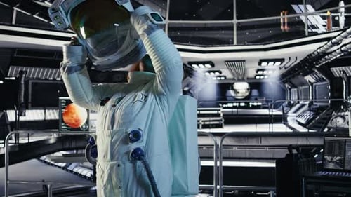 Joyous Astronaut Putting Helmet on Inside High Tech Spacecraft