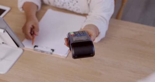 Card Payment Being Processed With a Wireless Terminal