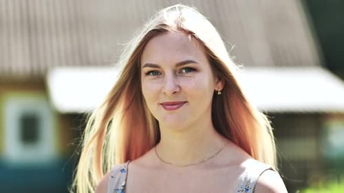 Blonde Woman Posing Outdoors in Rural Setting
