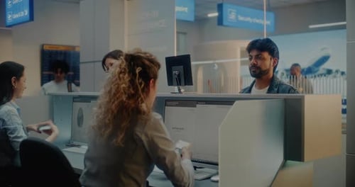 Multiethnic Passengers at Checkin Counter in International Airport Terminal
