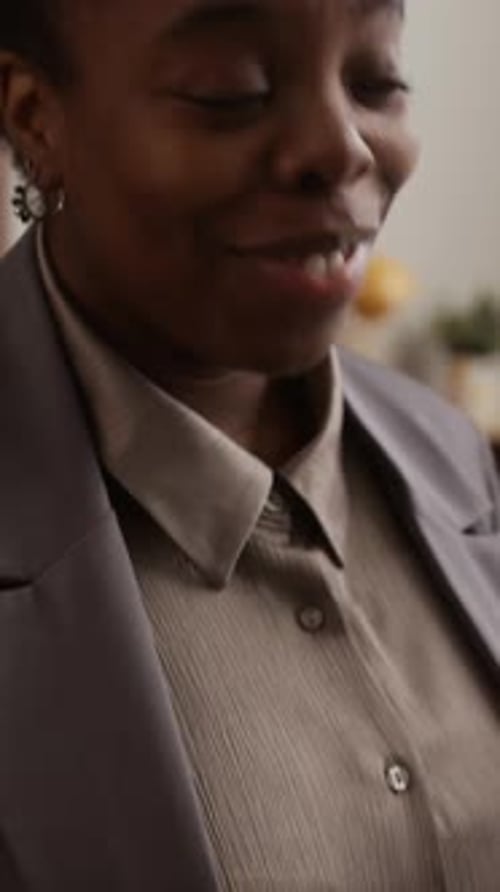 Woman Wearing Blazer Speaking Indoors Close Up Portrait