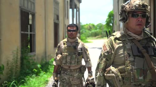 Military army soldiers tactical teamwork walking at ruin building.