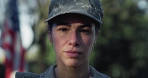 Close Up Slow Motion Portrait of Young Female Patriotic Soldier Standing in Front of the American