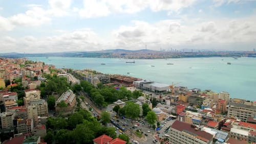 Aerial drone view of Istanbul, Turkey. Bosporus strait with multiple floating ships, residential bui
