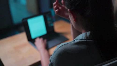 Woman Working at Laptop with Shoulder Pain