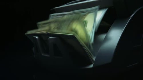 Money counter machine counts hundred dollar bills quickly