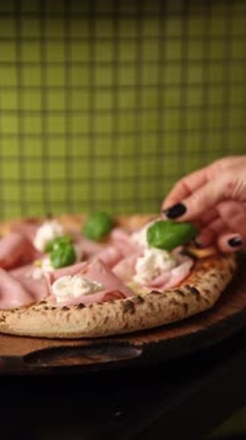 Delicious Pizza Topped with Meat and Basil