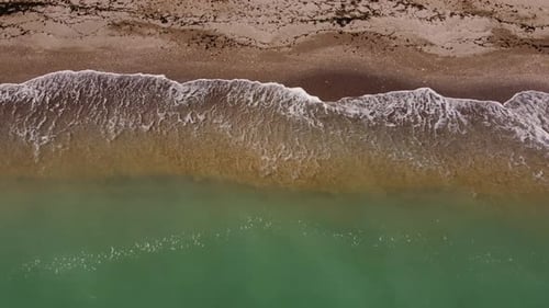 Aerial View Of Sandy Beach And Turquoise Water