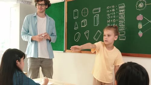 Smart boy pointing at diverse friend while children sitting at class. Pedagogy.