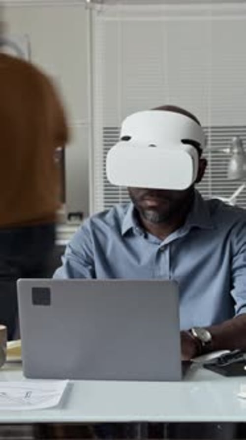 Vertical Timelapse of Black Male Engineer Using VR Headset in Office
