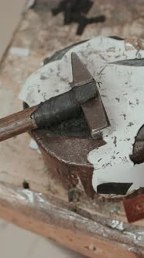 Vertical - Closeup of Hammer on Cobbler Workbench in Shoe Workshop