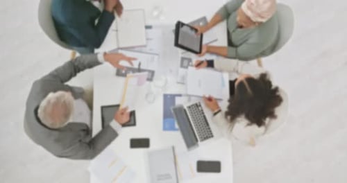 Blurred Aerial View of Office Meeting