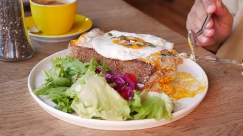 Close-Up of Toast with Fried Egg and Salad
