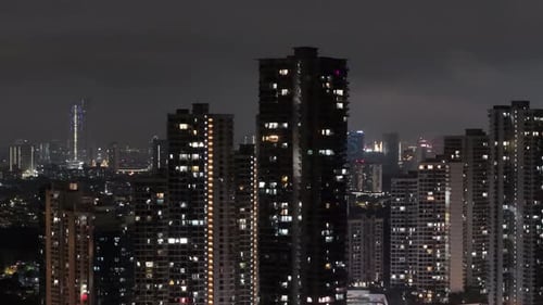 City skyline at night with many tall buildings at Danga Bay