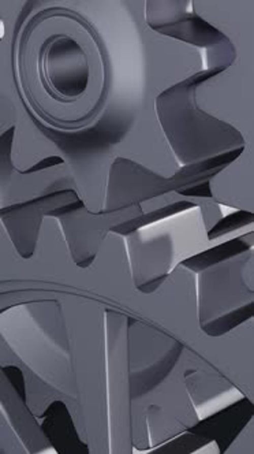 Intricate Array of Rotating Interlocking Metal Gears in CloseUp View