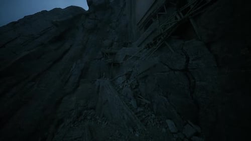 Rock Debris Scattered Along a Steep Mountain Slope in Low Light Conditions