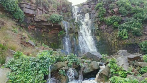 Aerial drone footage of a tall rocky waterfall in the Yorkshire Dales, Pennies. Moorland scene of a