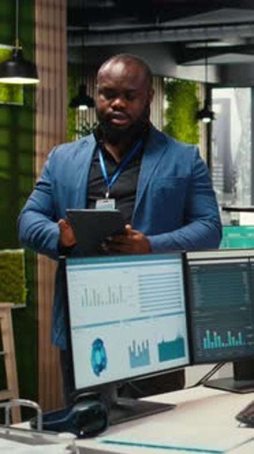Vertical Video Corporate Professional Analyzes Efficiency Through Charts and Graphs