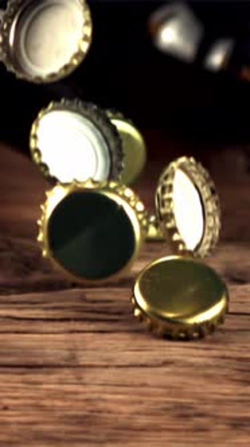 Super Slow Motion Beer Lids Fall on the Table and Rotate Filmed on a Highspeed Camera at 1000 Fps