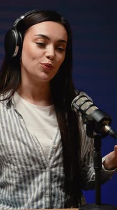 Woman Recording Podcast in Studio With Microphone
