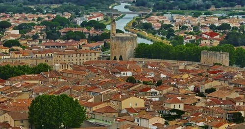 Aerial View of the Medieval Walled Town of AiguesMortes Near the Pink Salt Lake on a Sunny Day in
