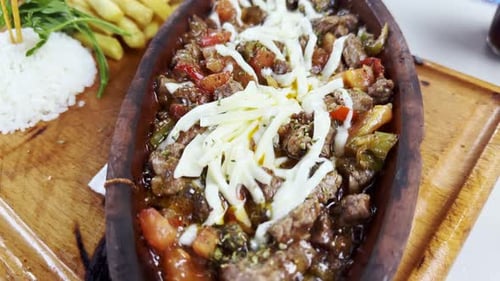 Close Up of Food Dish With Meat and Vegetables
