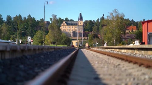 View of a castle in Zruč nad Sázavou in Bohemia, seen behing a railway line