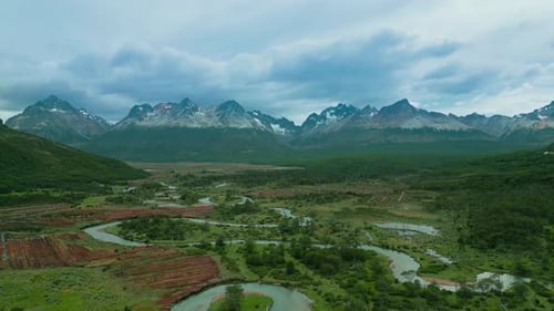 Scenic Aerial View of Valley with Winding River with Forest and Mountains on Patagonia Andes at