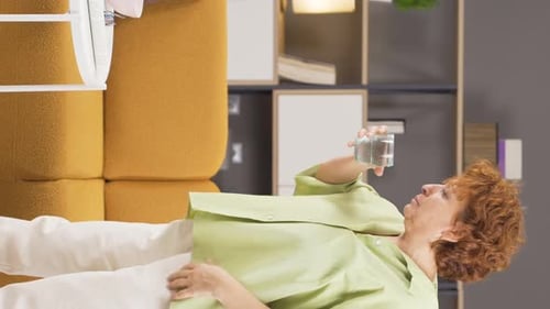 Vertical video of Woman with COPD is coughing.