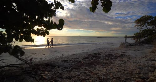 Romantic sunset walk on the beach a diverse couple shares true love together