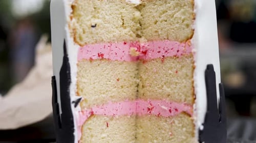 A slice of a delicious birthday cake on the table - close up