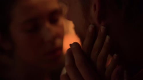 Loving Couple Holding Hands in Warm Light