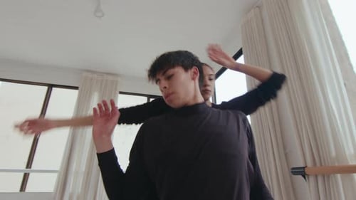Young Dancers Performing a Duet in Studio