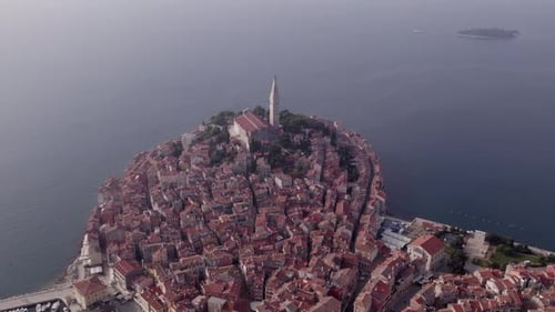 Aerial view of old town with church and port by Adriatic Sea, Croatia.