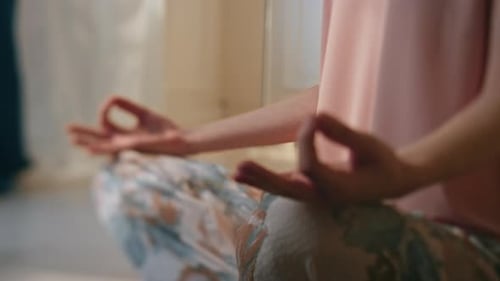 Woman Meditating in Peaceful Yoga Pose Indoors