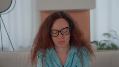 Young Woman Using Smartphone Inside Home