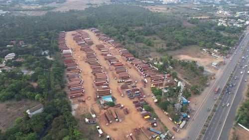 An aerial video showing a container warehouse and truck yard in the middle of the highway. Longstand