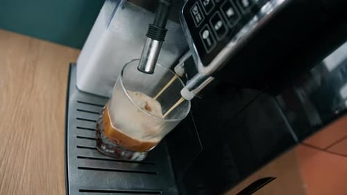 Making coffee into cup coming out from an automatic coffee maker machine Beverage drink breakfast