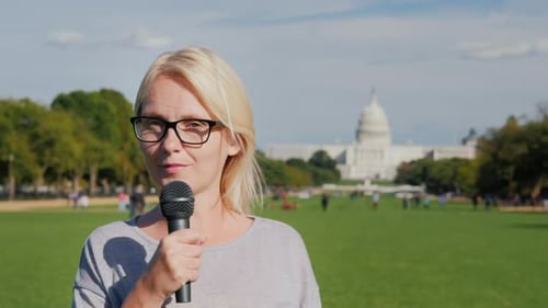 Woman Reporter Talking in Front of US Capitol Building