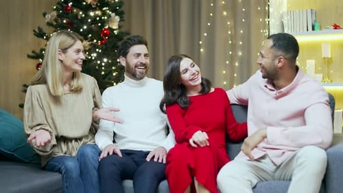 Friends Laughing Together at Christmas Celebration