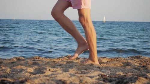 Legs on the Beach Close Up Walking Along the Beautiful Beach at Sunset Embracing Nature and Its